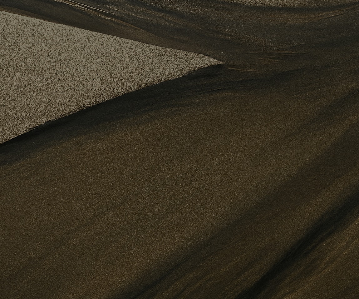 Abstract patterns in sand and shadows.