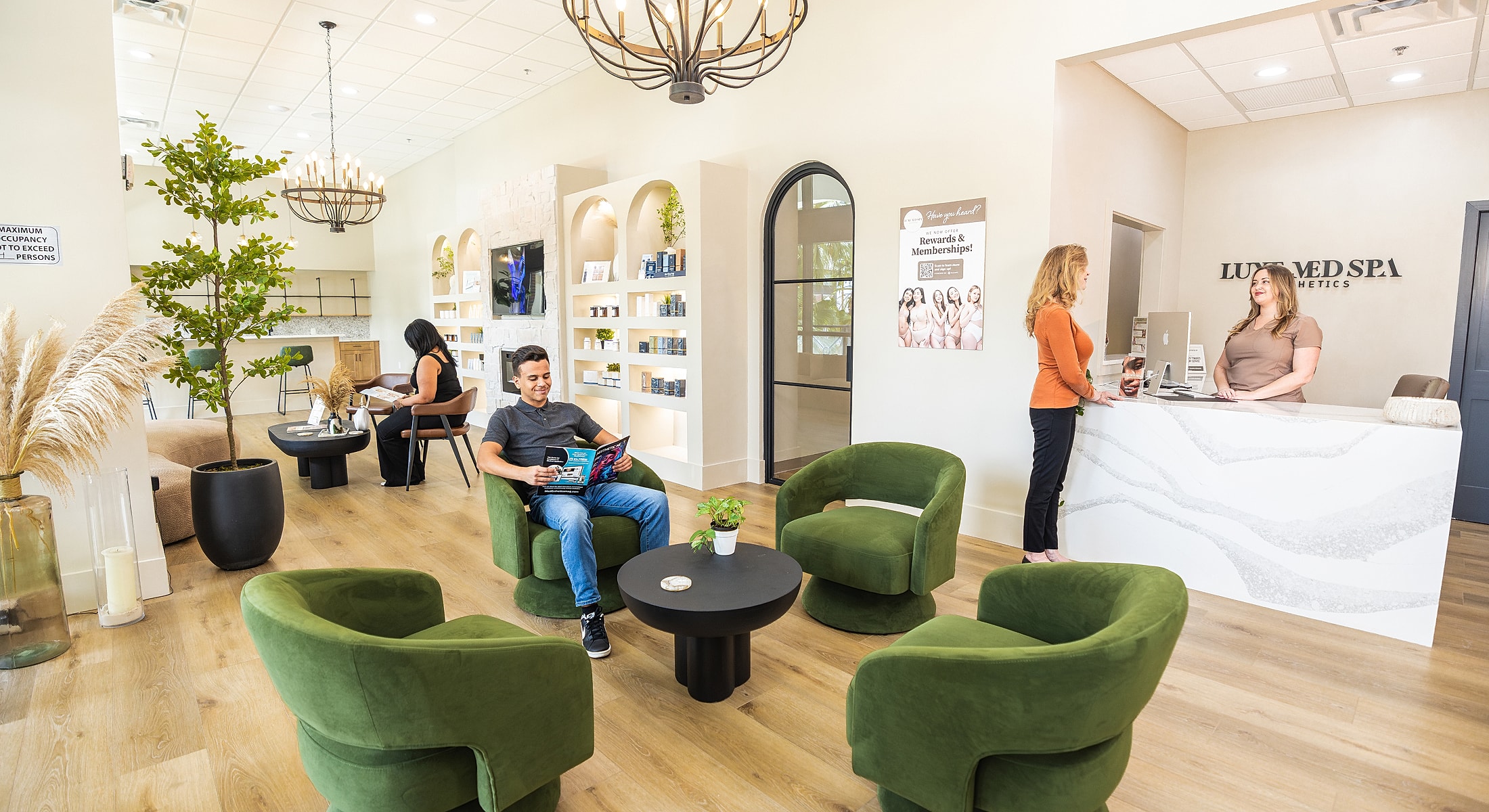 Spa reception area with clients and staff.