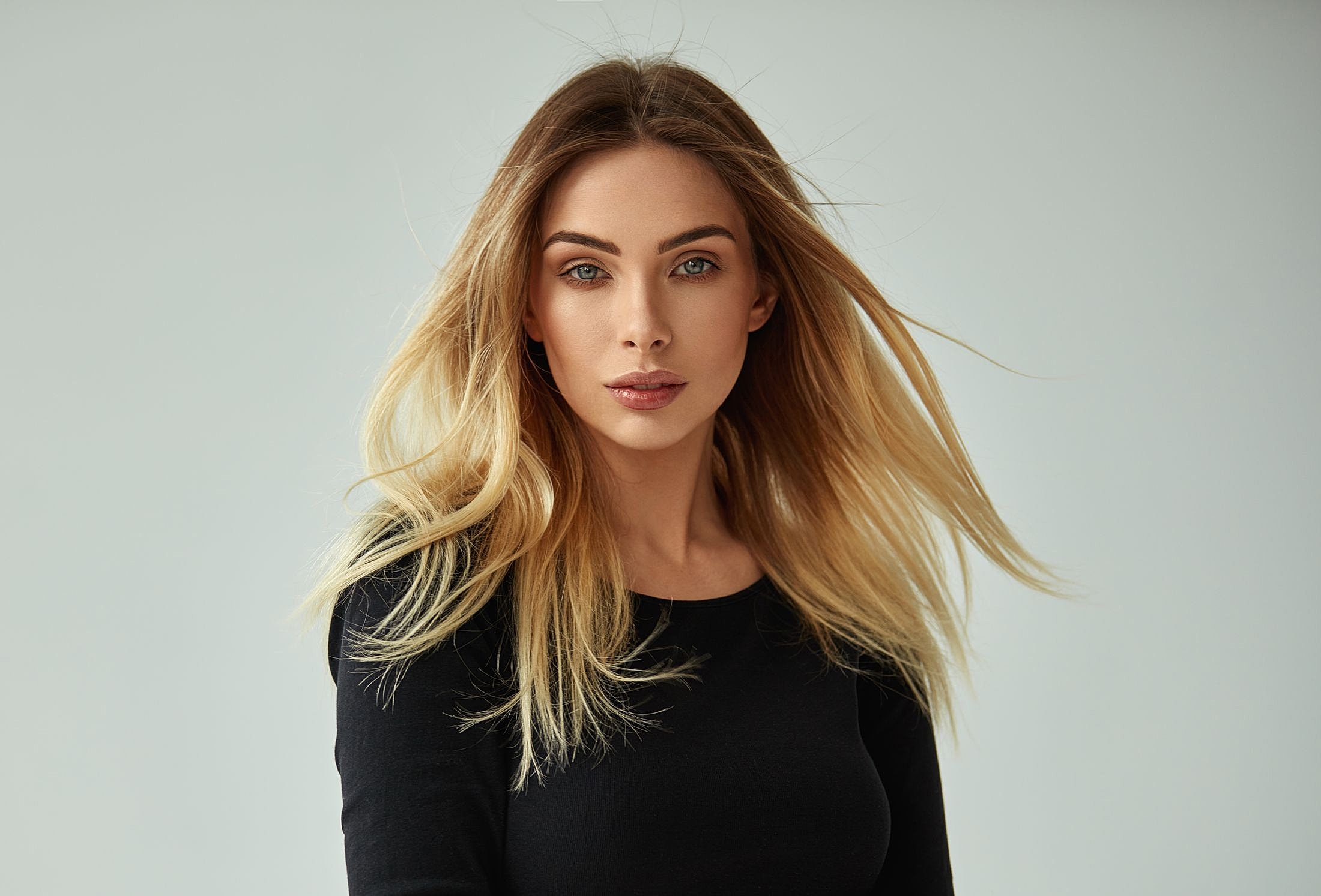 Portrait of a woman with long, flowing hair.